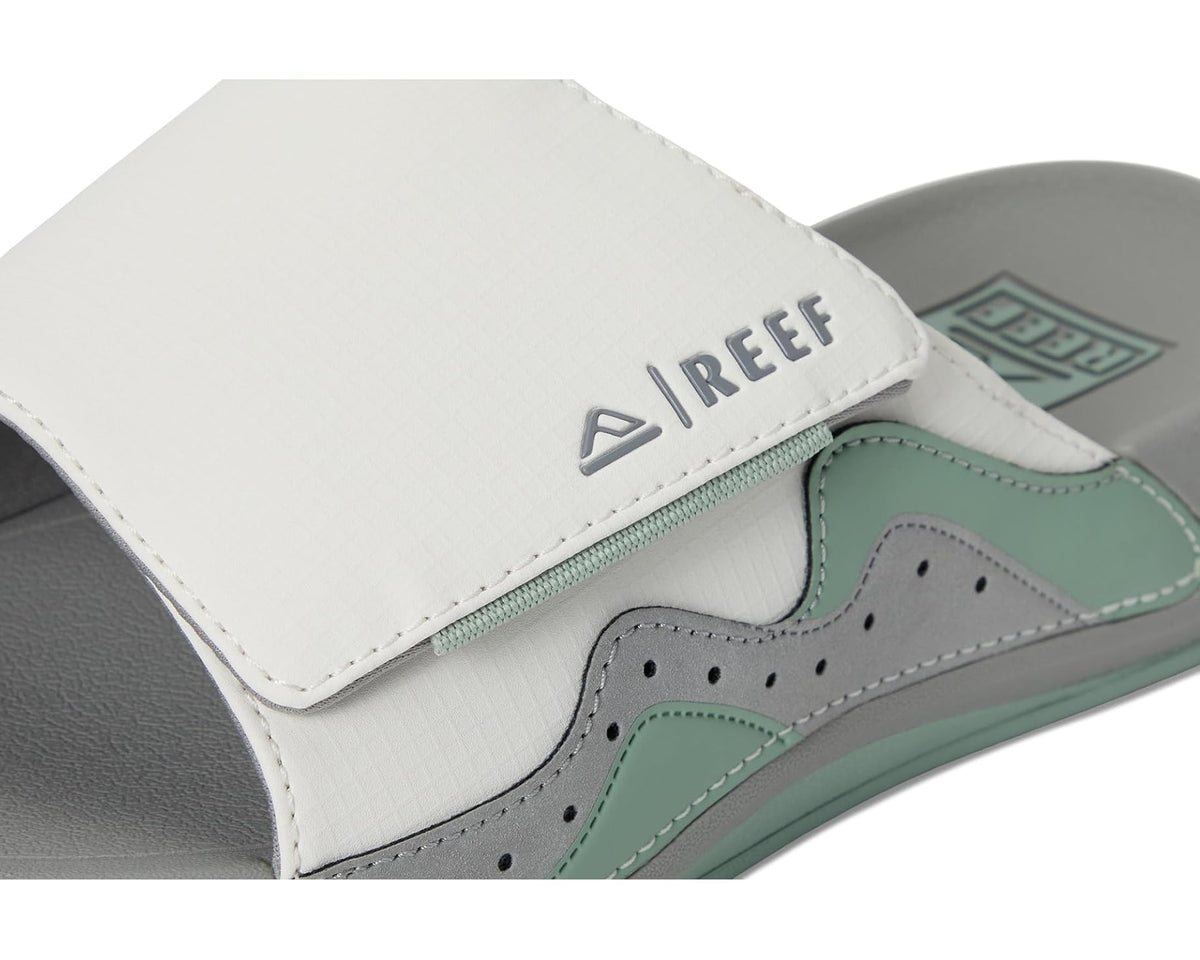 Reef Swell Cruiser slide detail: white strap with Reef logo and green trim