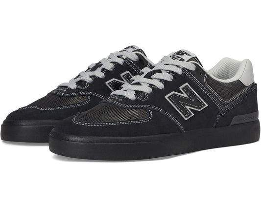 Men's New Balance 574 Vulc sneakers, black with white accents and lace-up.