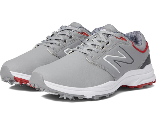 Grey New Balance golf shoes with red accents, lace-up design and white sole