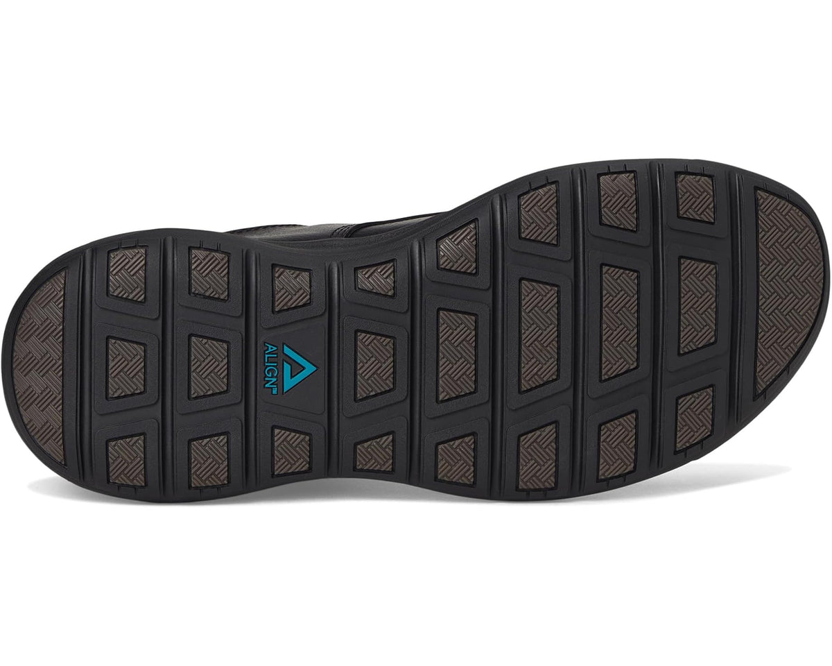 Black rubber outsole with patterned tread and blue logo near heel