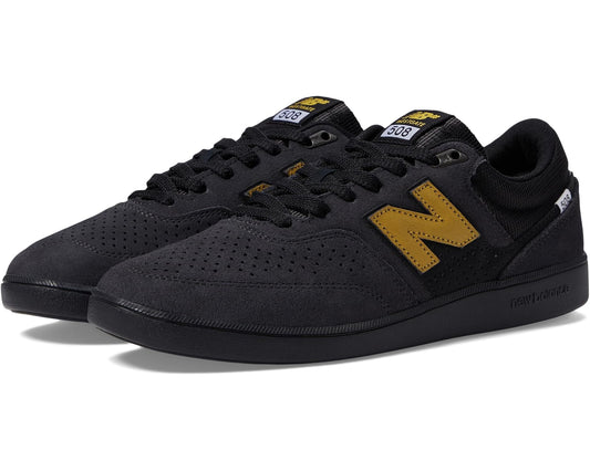 Unisex skate shoes in dark charcoal with yellow accents, lace-up with suede upper.