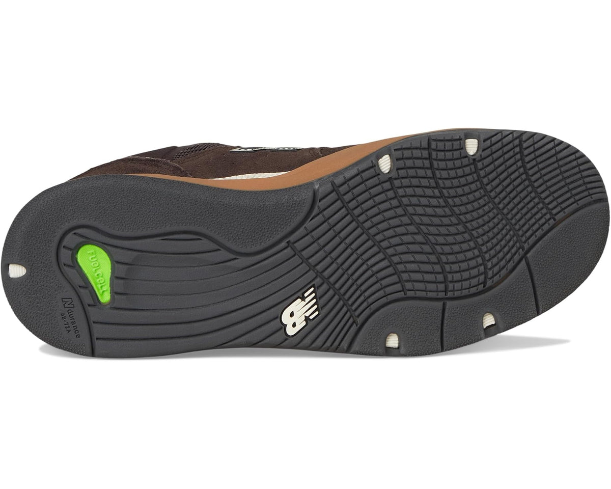 Brown New Balance 1010 outsole with deep black tread and small green logo detail.