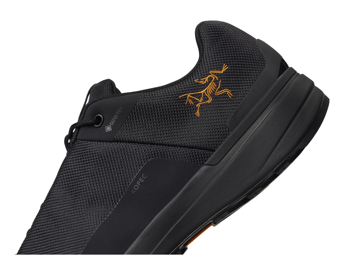 Unisex Arc'teryx Kopec GTX black upper close-up with yellow emblem and lacing