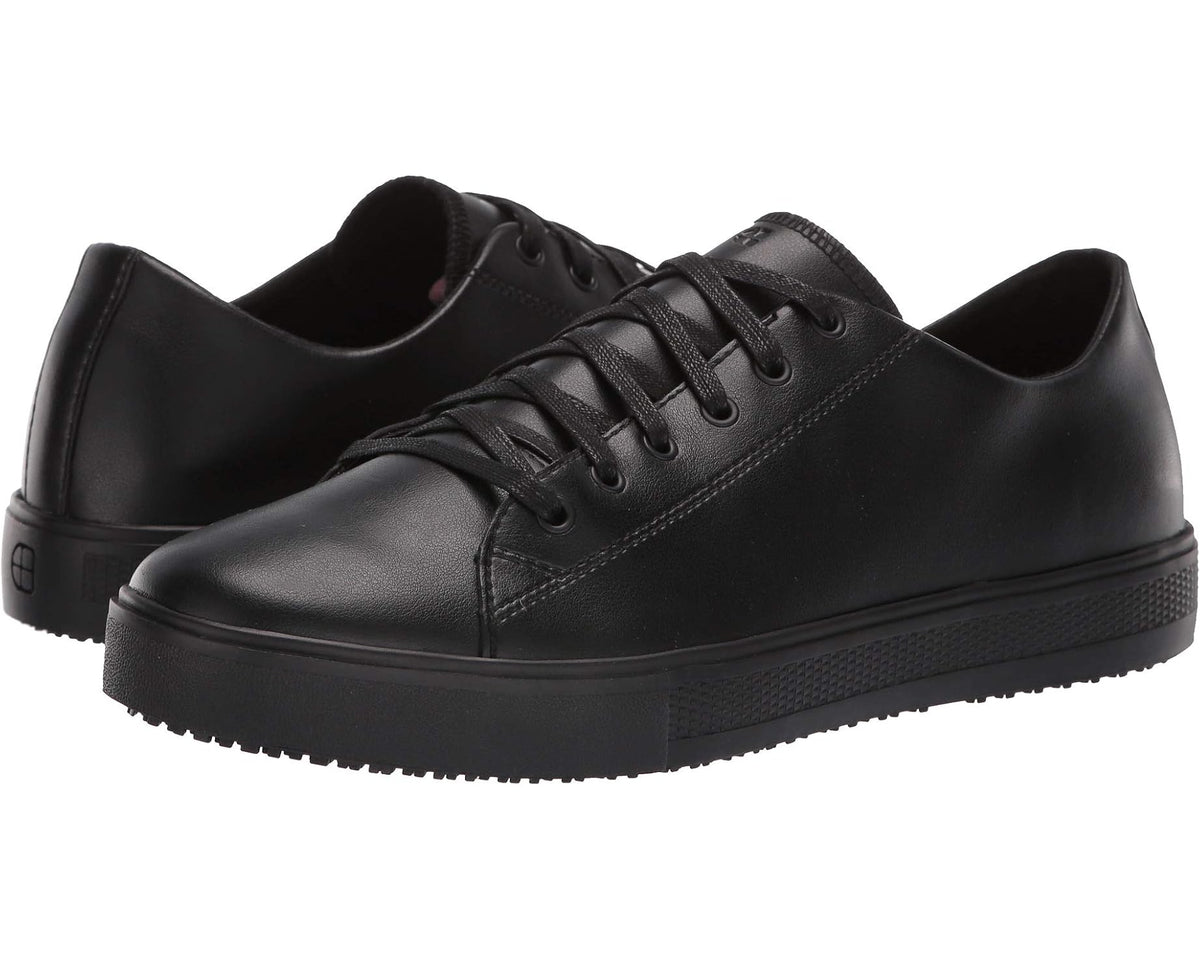 Black lace-up low-top work shoes with rubber outsole, old-school style