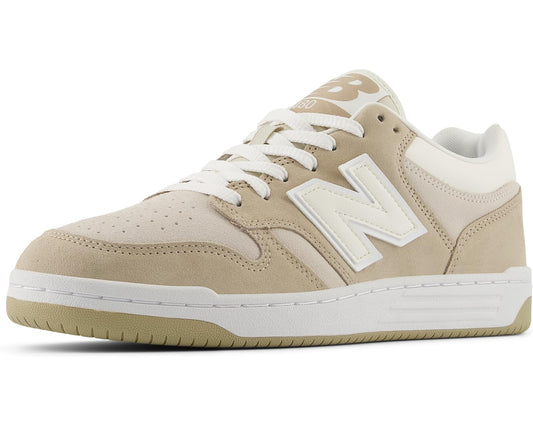 Beige and white New Balance Classics lace-up sneaker with side 'N' logo.