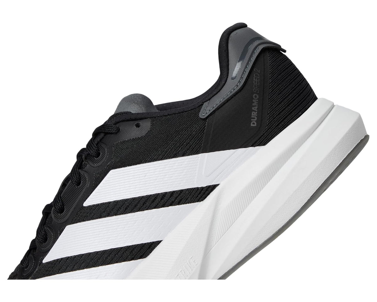 Men's adidas Duramo Speed 2 running shoes, side view of black upper with bold white stripes