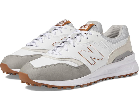 New Balance golf shoes in white and grey with orange-brown traction outsole