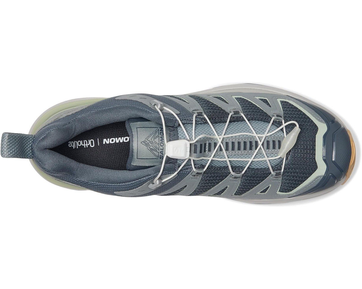 Men's lace-up trail shoe with mesh upper and layered protective overlays in blue-gray