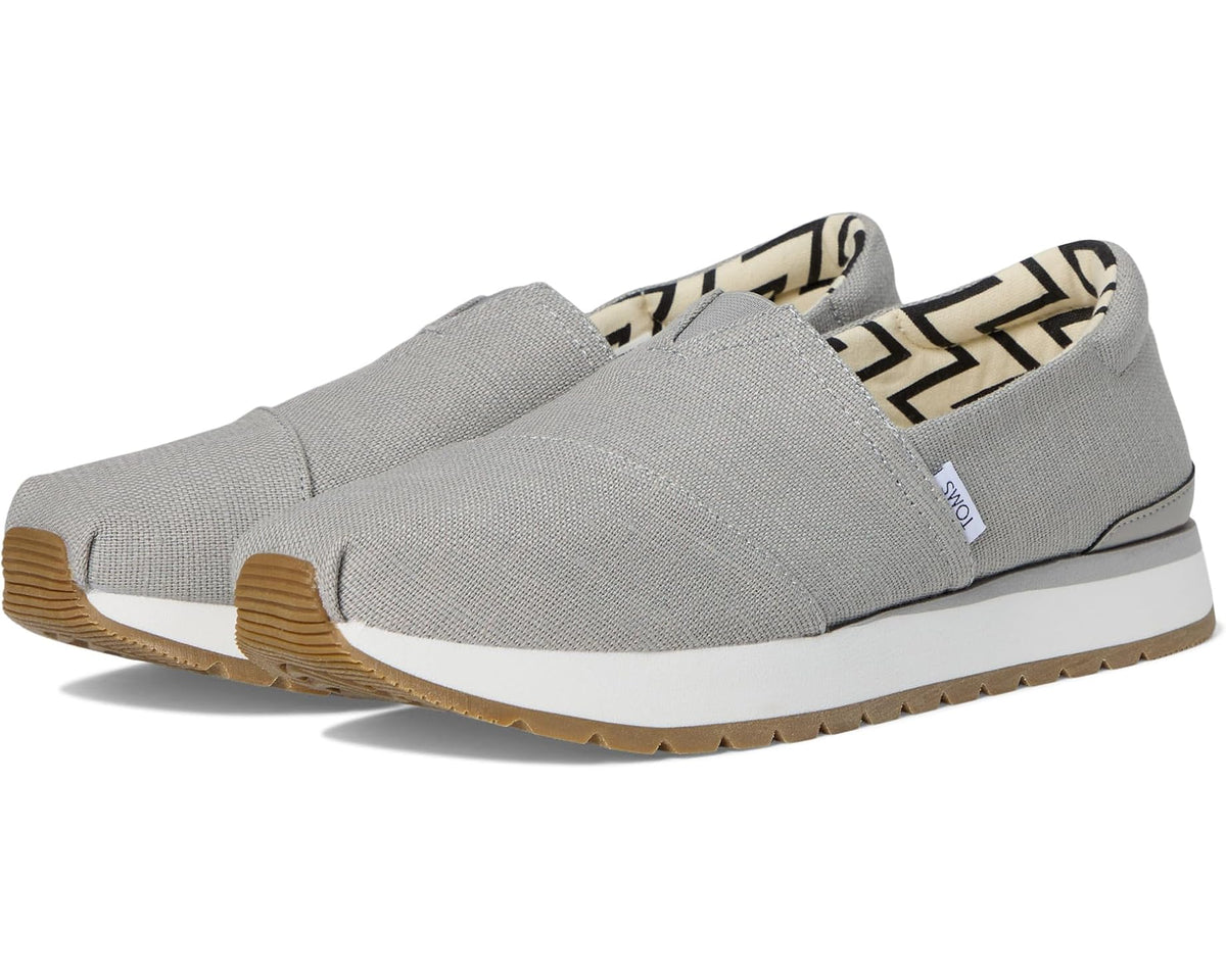 Men's TOMS Resident Plus slip-on shoes in grey fabric, brown outsole tread, no laces.