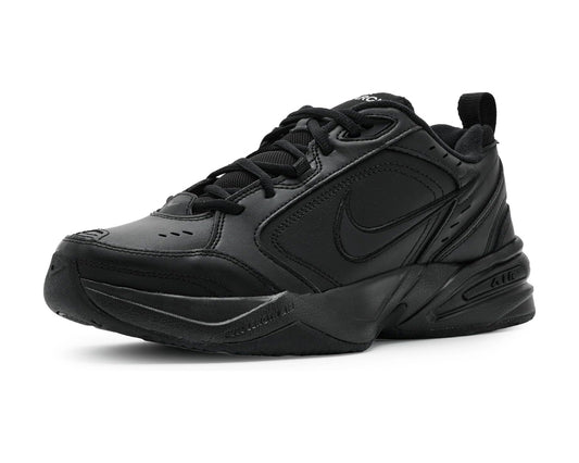 Men's Nike Air Monarch IV sneakers, black with swoosh and lace-up design.