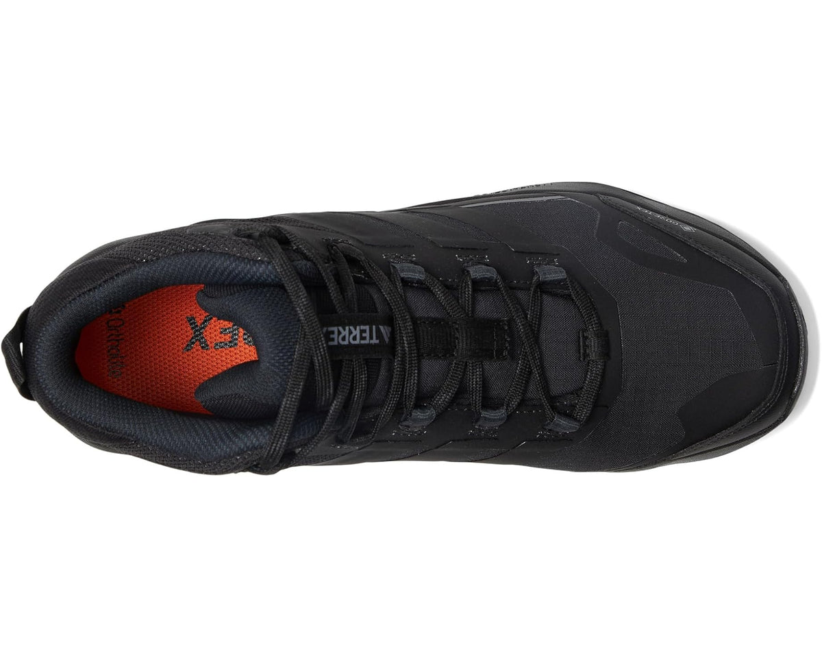 Black hiking shoe side view with lace-up closure and cushioned collar