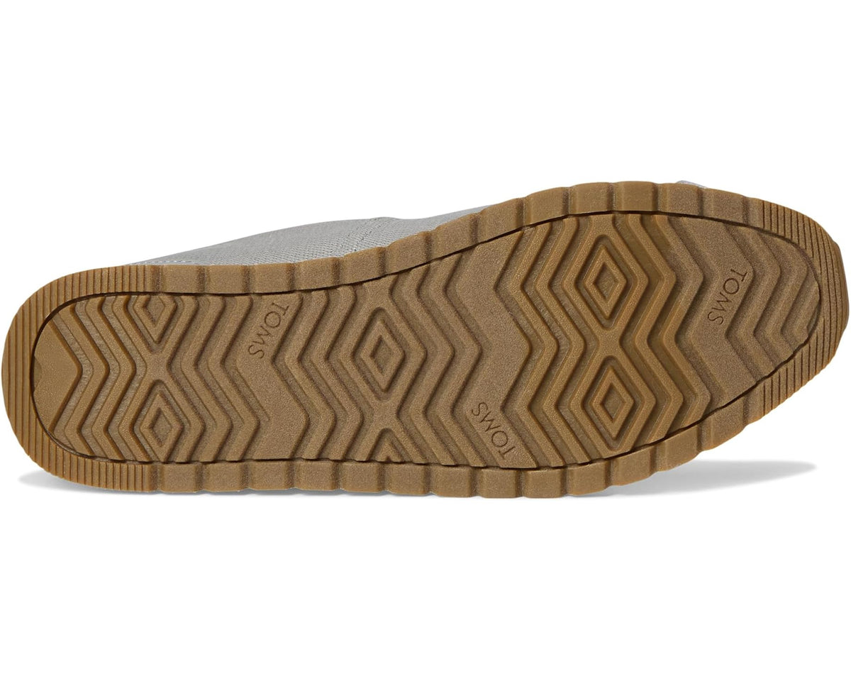 Men's TOMS Resident Plus outsole with brown tread and zigzag grip pattern.