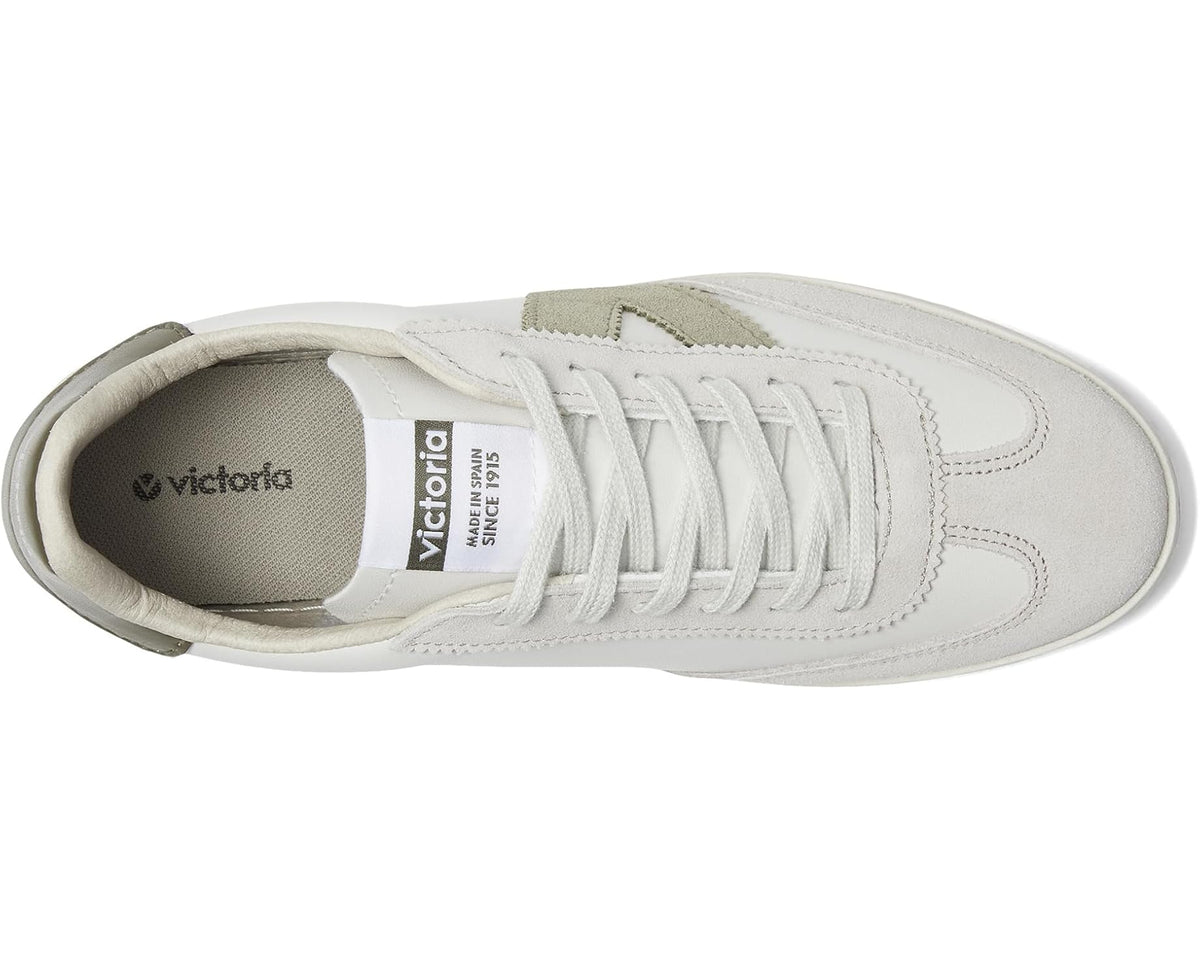 White lace-up sneaker with olive heel lining and visible tongue and insole label