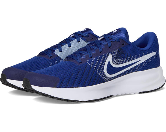 Blue Nike running shoes with white swoosh, lace-up mesh upper and black outsole