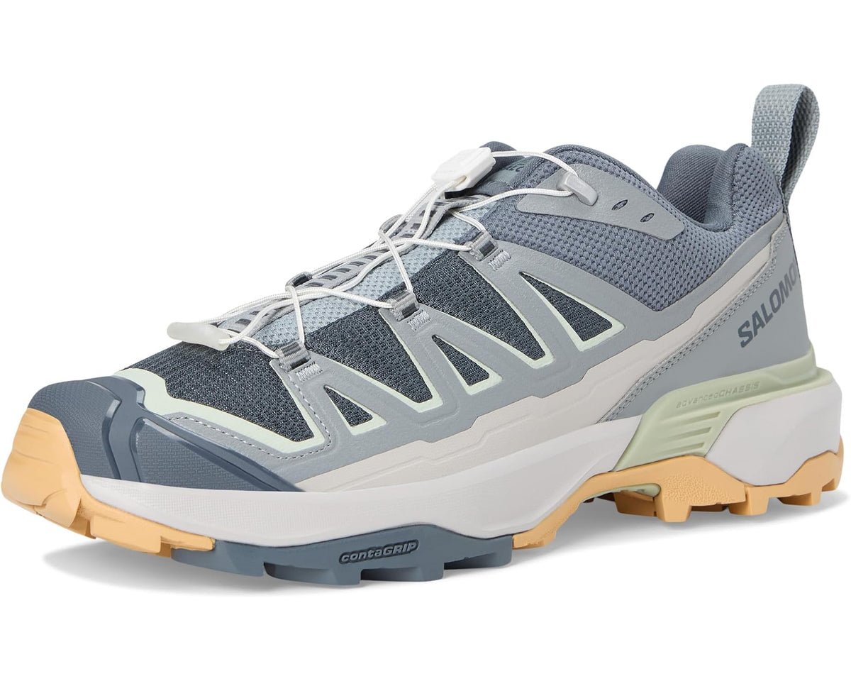 Men's lace-up trail shoe front three-quarter view in blue-gray with light green accents