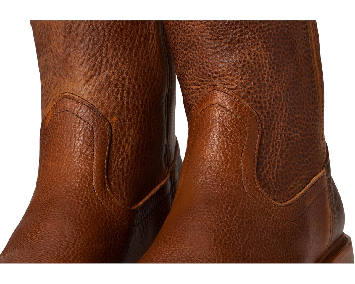 Brown leather ankle boot upper close-up with curved panel stitching