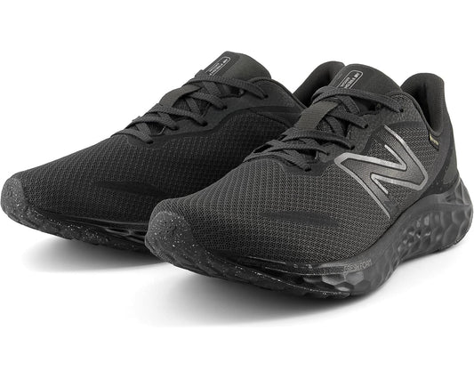 Men's black mesh running shoe with lace-up and silver New Balance logo