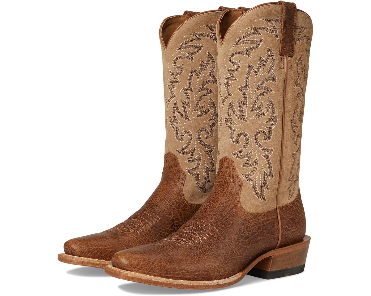 Tan cowboy boots with ornate floral side embroidery and pull-on tab