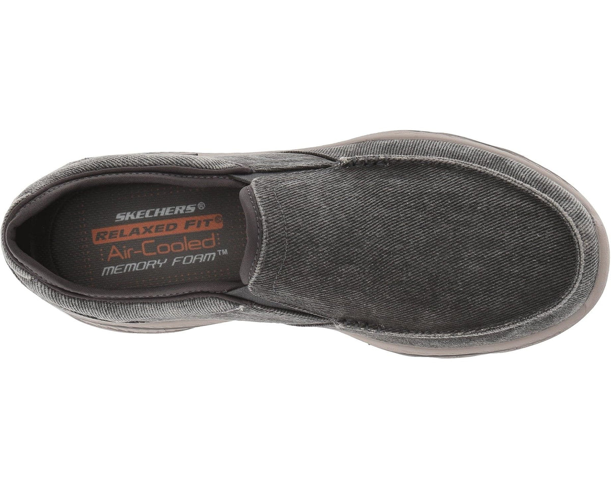 SKECHERS charcoal slip-on sneaker viewed from the side with padded collar