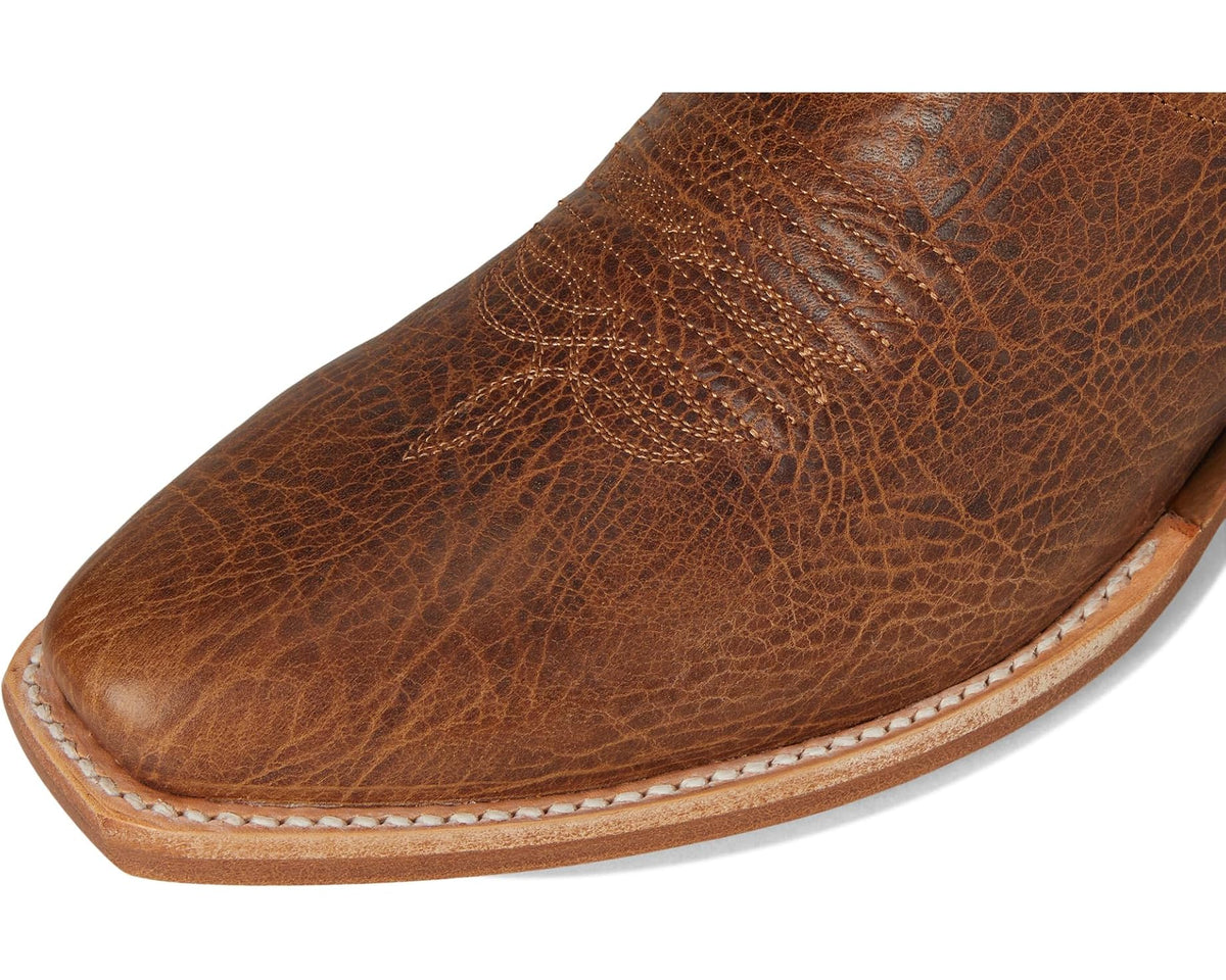 Tan leather cowboy boot with textured upper and stitched rounded toe