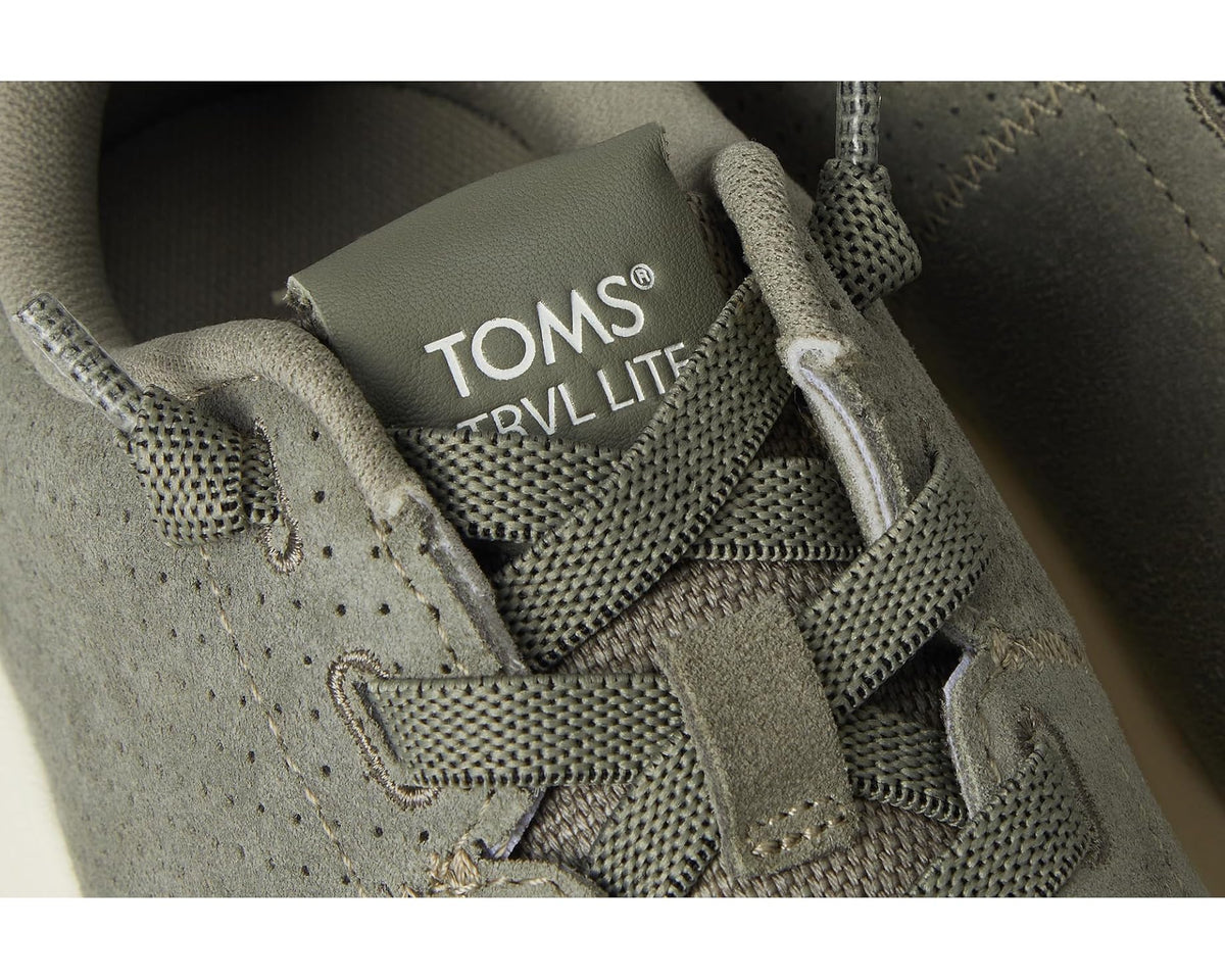 TOMS TRVL LITE heel label, laces and stitching on vetiver grey suede sneaker