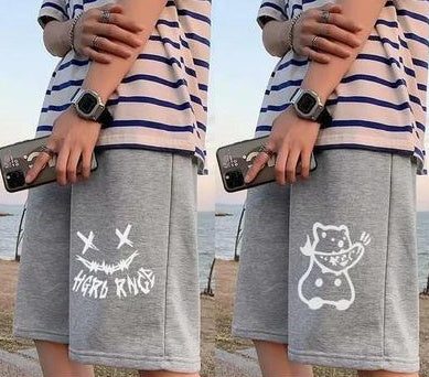 Light gray straight sports shorts with white skull-and-crossbones style graphic on the leg.
